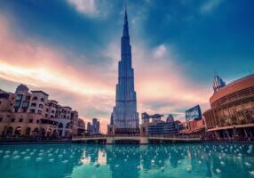 Burj Khalifa in Dubai, UAE. The tallest skyscraper building in the world, travel attraction with blue pool on foreground